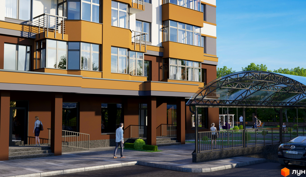 Зображення фасаду та прибудинкової території Житлового комплексу Капітал 2. Багатоповерховий будинок з великими вікнами та облаштованим подвір'ям.