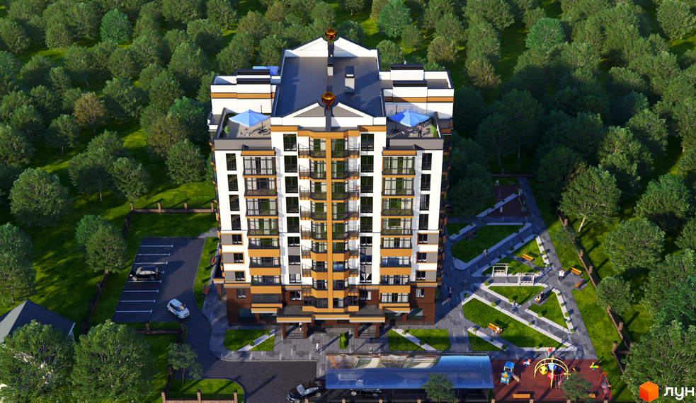 Вигляд з висоти на Житловий комплекс Капітал 2: багатоповерховий будинок з балконами, парковка, дитячий майданчик та зелені насадження.