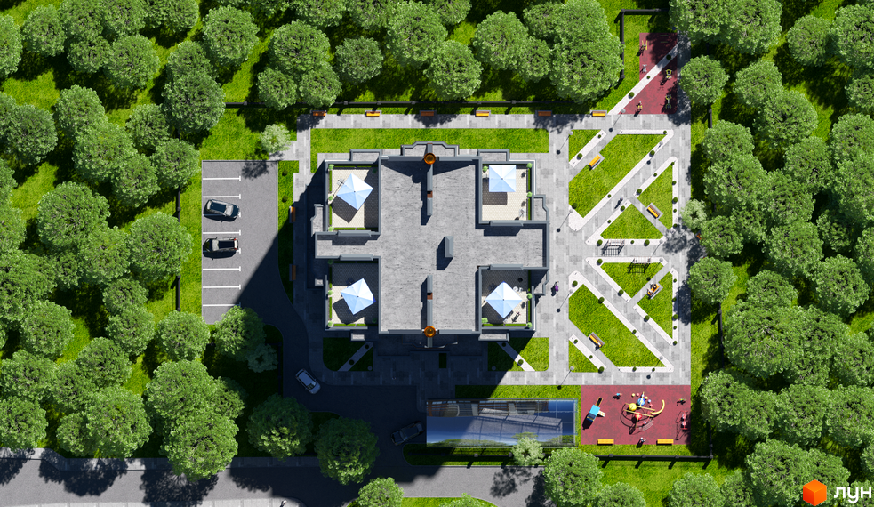 Вигляд зверху на Житловий комплекс Capital 2: сіра будівля з терасами, зелений двір з деревами, дитячий майданчик та парковка.