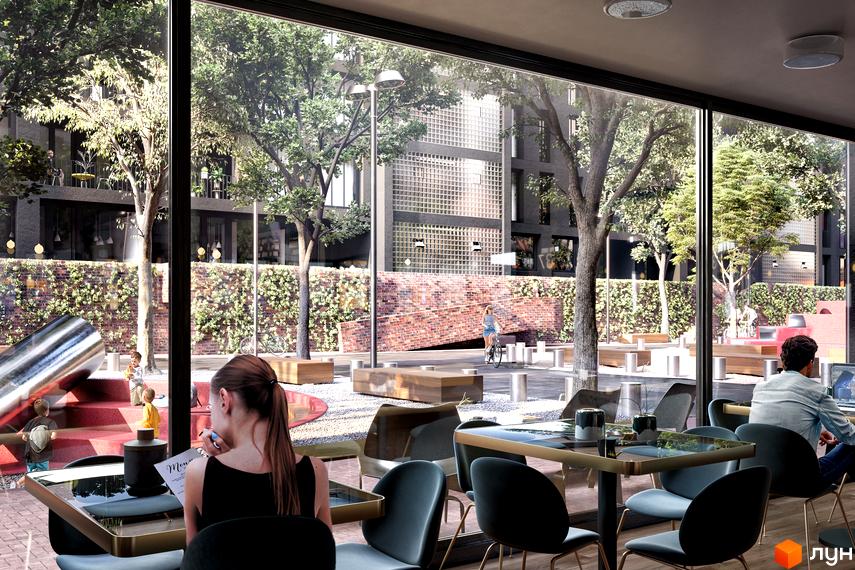 Зовнішній вигляд новобудови ЖК 044 з великими вікнами та зеленою прибудинковою територією. На території є дитячий майданчик та місця для відпочинку.