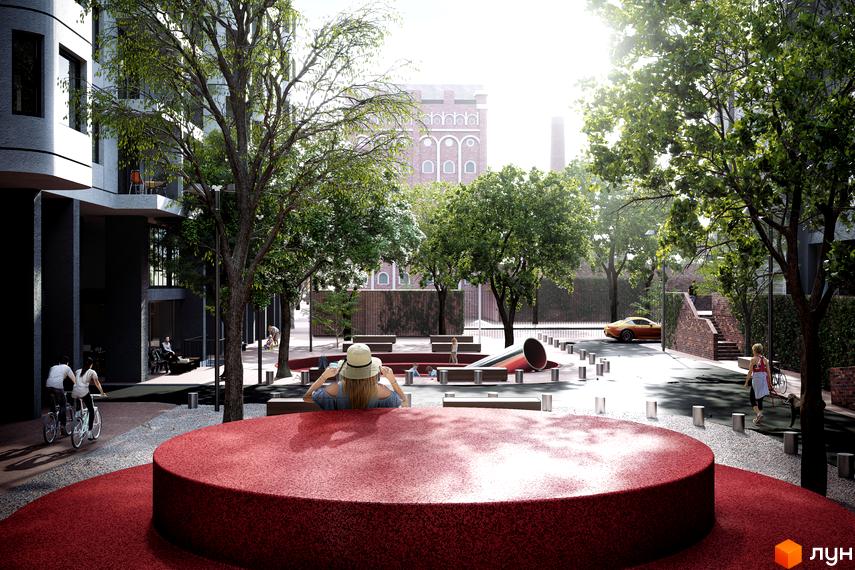 Житловий комплекс з червоною зоною відпочинку та дитячим майданчиком. Навколо будинку багато зелені та місця для прогулянок.