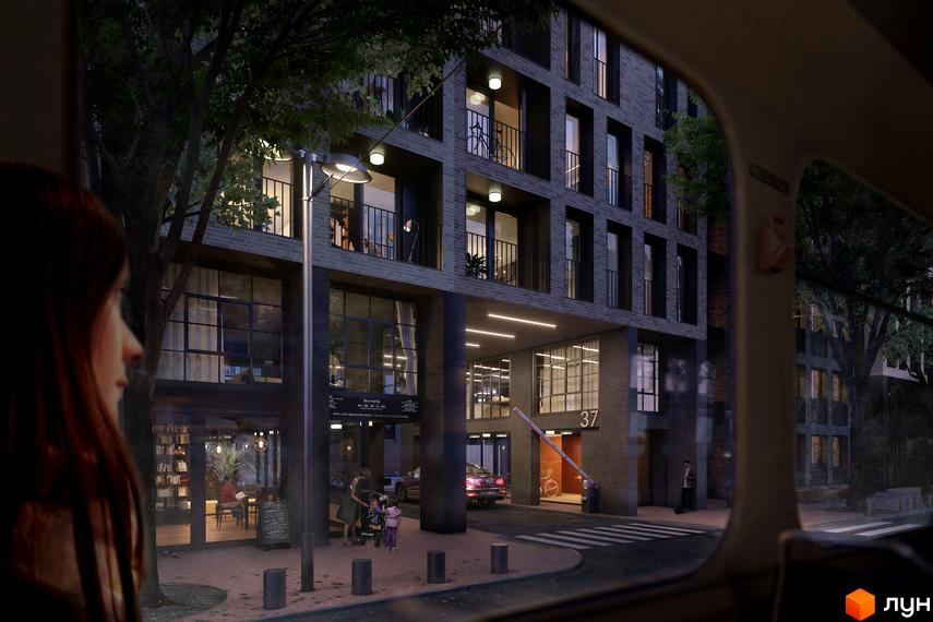 Житловий комплекс 044 з темним цегляним фасадом та великими вікнами. На першому поверсі комерційні приміщення, вхід з шлагбаумом та пішохідна зона.