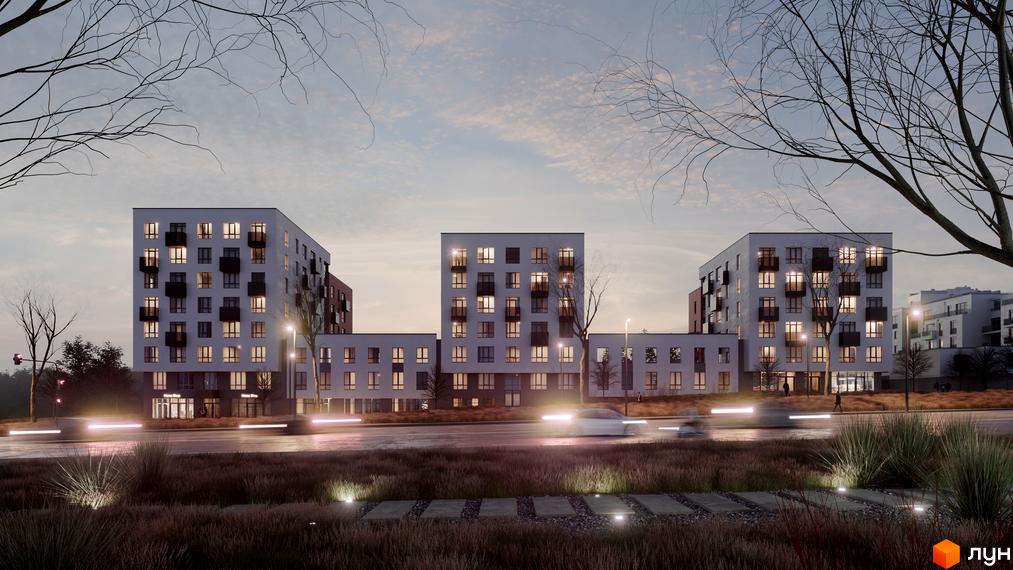 Житловий комплекс HYGGE ввечері. Білі багатоквартирні будинки з темними балконами, освітлені вікна, дорога з рухом та прибудинкова територія.