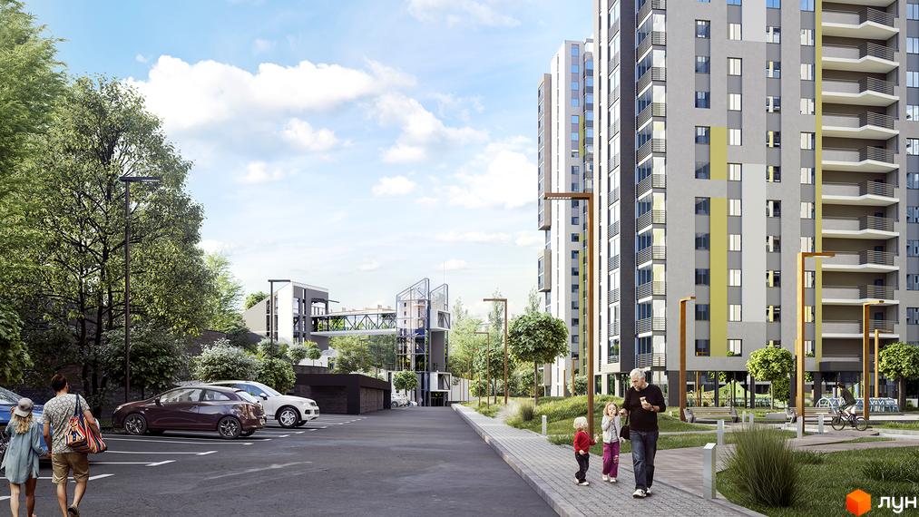 Зовнішній вигляд будинку ЖК Голосіївська Долина з сірими фасадами та балконами. Прибудинкова територія з парковкою, деревами та пішохідними доріжками.