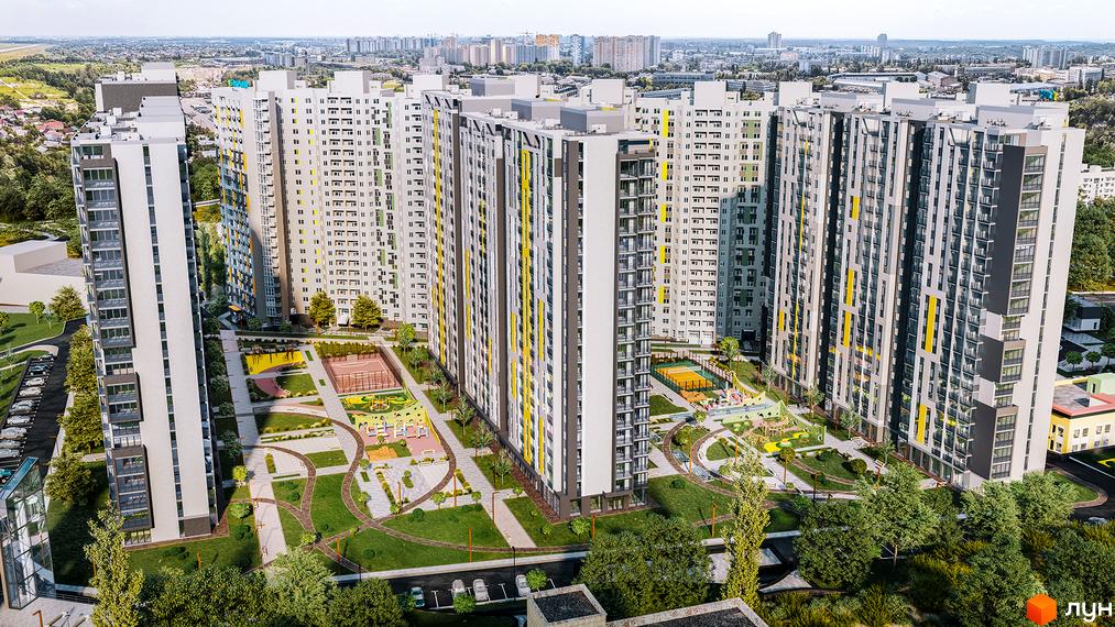 Житловий комплекс Голосіївська Долина - вид з висоти пташиного польоту на багатоповерхові будинки та зелену прибудинкову територію з дитячими та спортивними майданчиками.