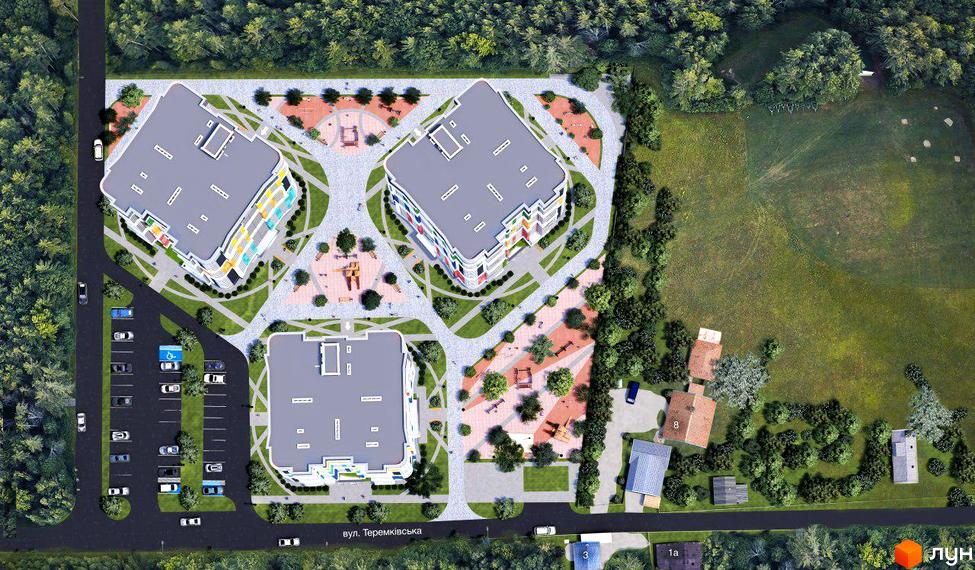 Житловий комплекс Абрикосовий: вид зверху на три багатоповерхові будинки з кольоровими фасадами та прибудинкову територію з дитячими майданчиками та парковкою.