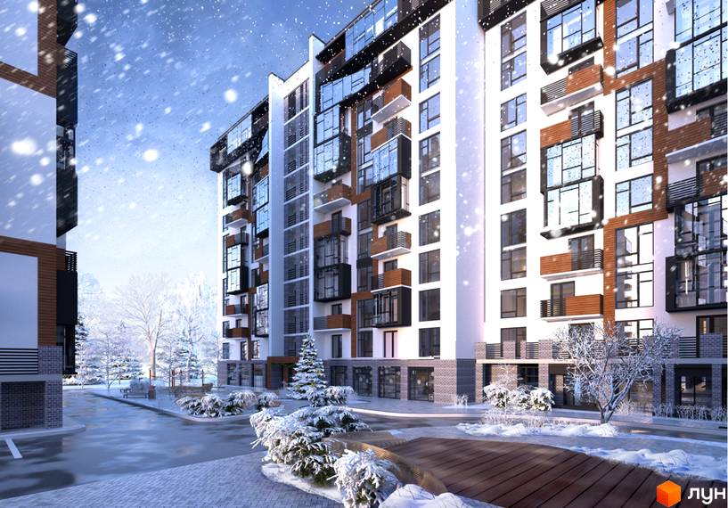 Зовнішній вигляд новобудови ЖК Перлина Проскурова взимку. Засніжена прибудинкова територія з деревами та доріжками.