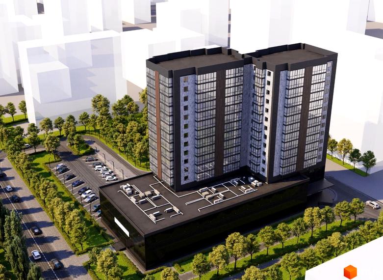 Новобудова ЖК Центральний з сірими та коричневими фасадами, скляними вікнами, на фоні паркування та зеленої зони з деревами.