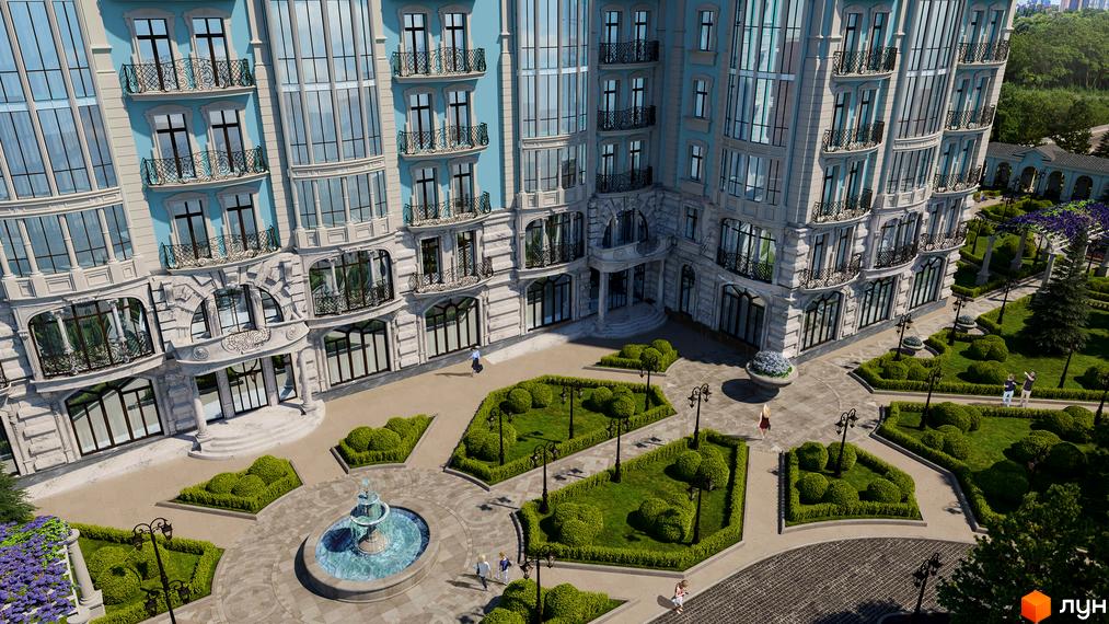 Клубний будинок Biarritz з елегантною архітектурою та доглянутою прибудинковою територією з фонтаном та зеленими зонами.