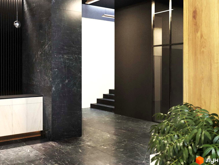 Житловий комплекс Avalon Up. Інтер'єр лобі з мармуровими колонами та підлогою, скляними перегородками та дерев'яними акцентами. Сходи ведуть на верхні поверхи.