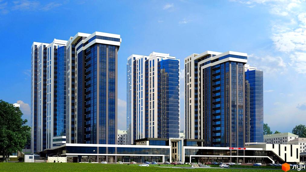 Високі будинки Житлового комплексу Панорама з панорамними вікнами на тлі блакитного неба. На першому поверсі розташовані комерційні приміщення, перед будинками зелена трава та парковка.