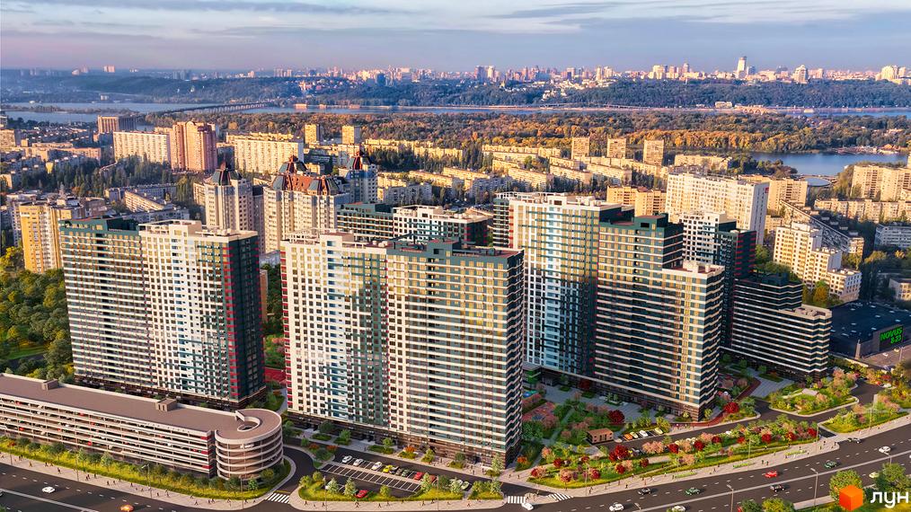 Житловий комплекс Галактика - сучасний архітектурний ансамбль з висотними будинками та доглянутою прибудинковою територією. На зображенні видно фасади будівель та зелені зони навколо.