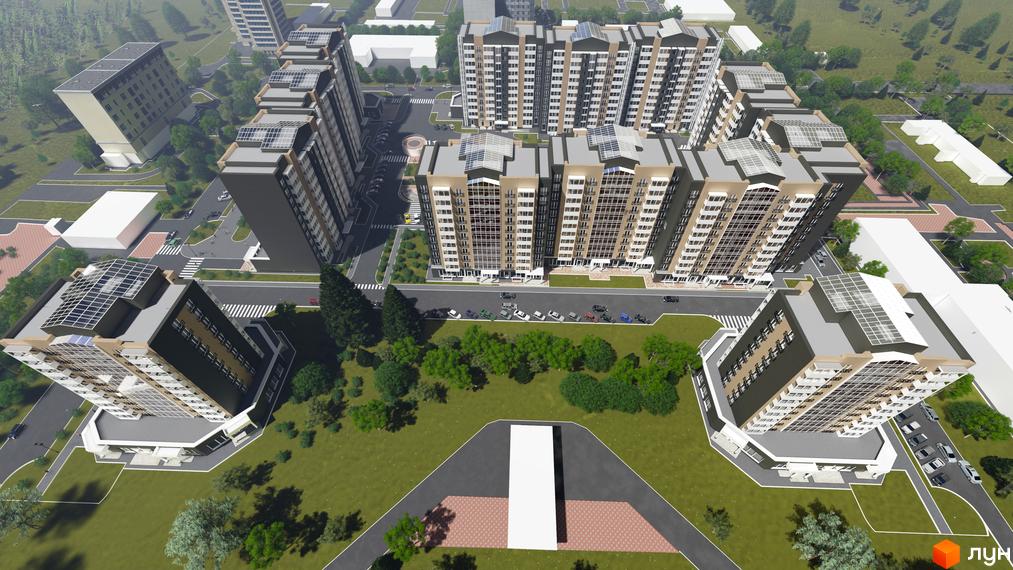 Комплекс Графський: аерофото багатоповерхових будівель з бежевими фасадами та скляними дахами. Прилегла територія має зелені зони, дороги та парковки.