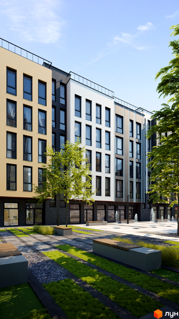 Житловий комплекс ATRIA CITY в районі Теремки. Фасад будинку з вікнами та балконами, перед ним облаштована прибудинкова територія з лавками та зеленими насадженнями.