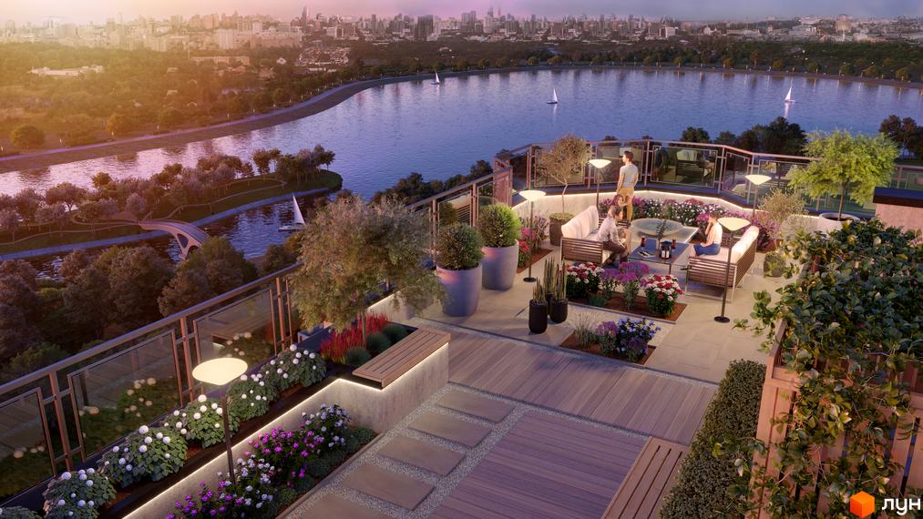 Житловий комплекс HydroPark DeLuxe: вид з тераси на річку та місто. На терасі розташовані зони відпочинку з диванами, кріслами та столиками, багато квітів та зелені.