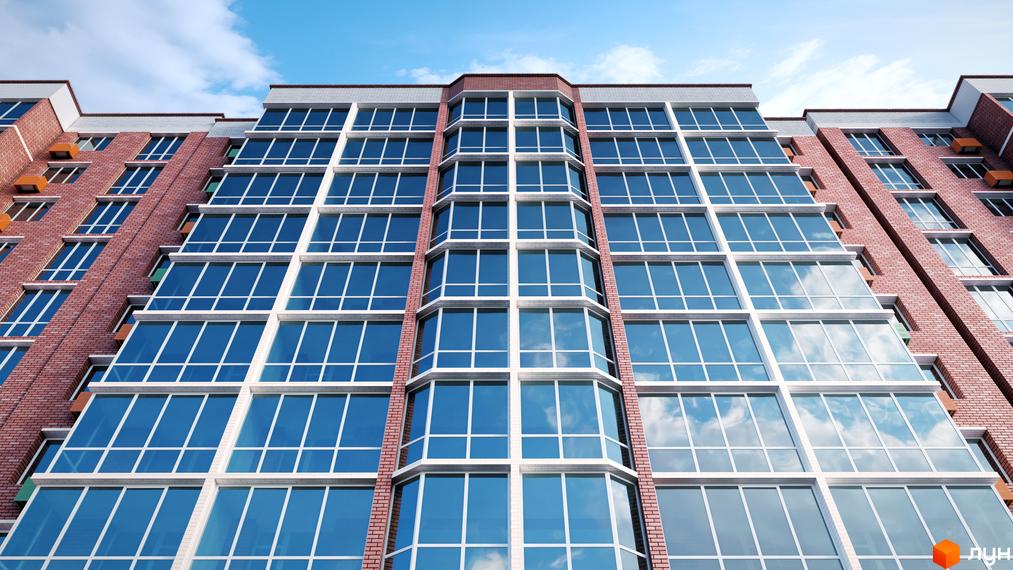 Зовнішній вигляд багатоповерхового будинку в Житловому комплексі Райдужний з великими вікнами та цегляним фасадом.