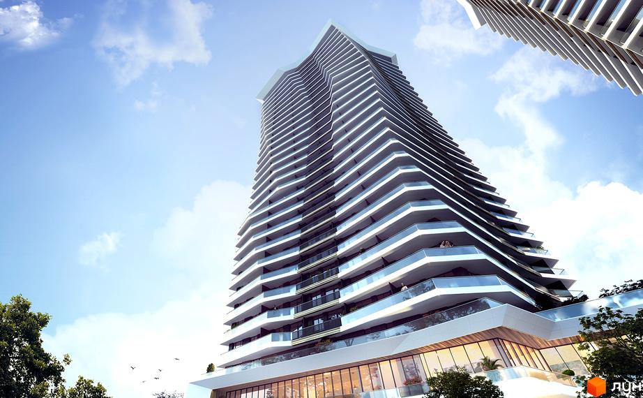 Новобудова ЖК Diadans з вигнутими фасадами та скляними балконами. Сучасна архітектура хмарочоса на тлі блакитного неба з хмарами.