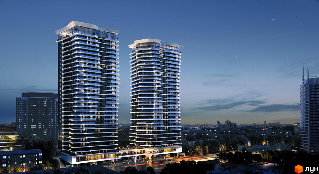 Житловий комплекс Diadans: дві високі вежі з панорамним склінням та підсвіткою, що розташовані в міському оточенні з прибудинковою територією та дорогою.