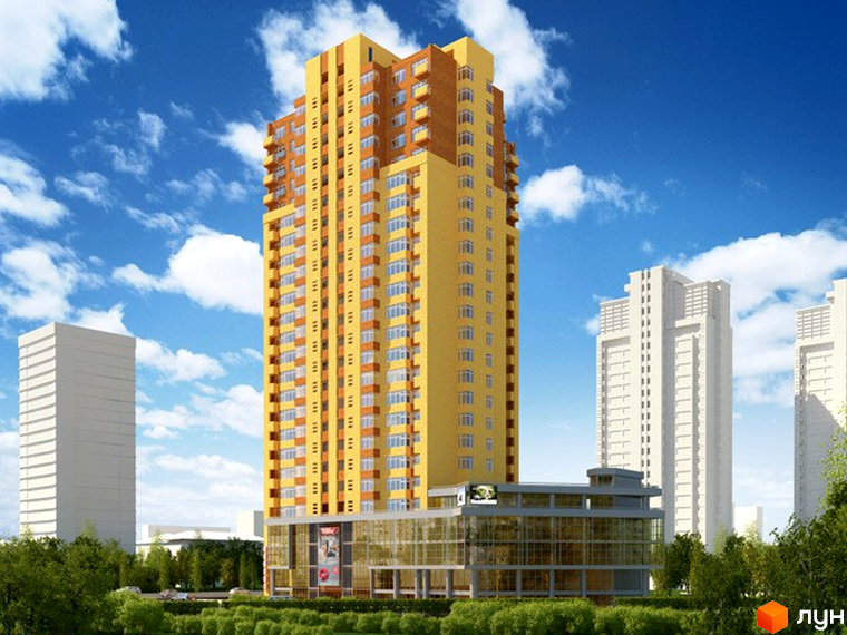 Багатоповерховий будинок Житлового комплексу Червонозоряний з жовтим та коричневим фасадом, скляним комерційним поверхом. Навколо зелені насадження та інші висотні будівлі.