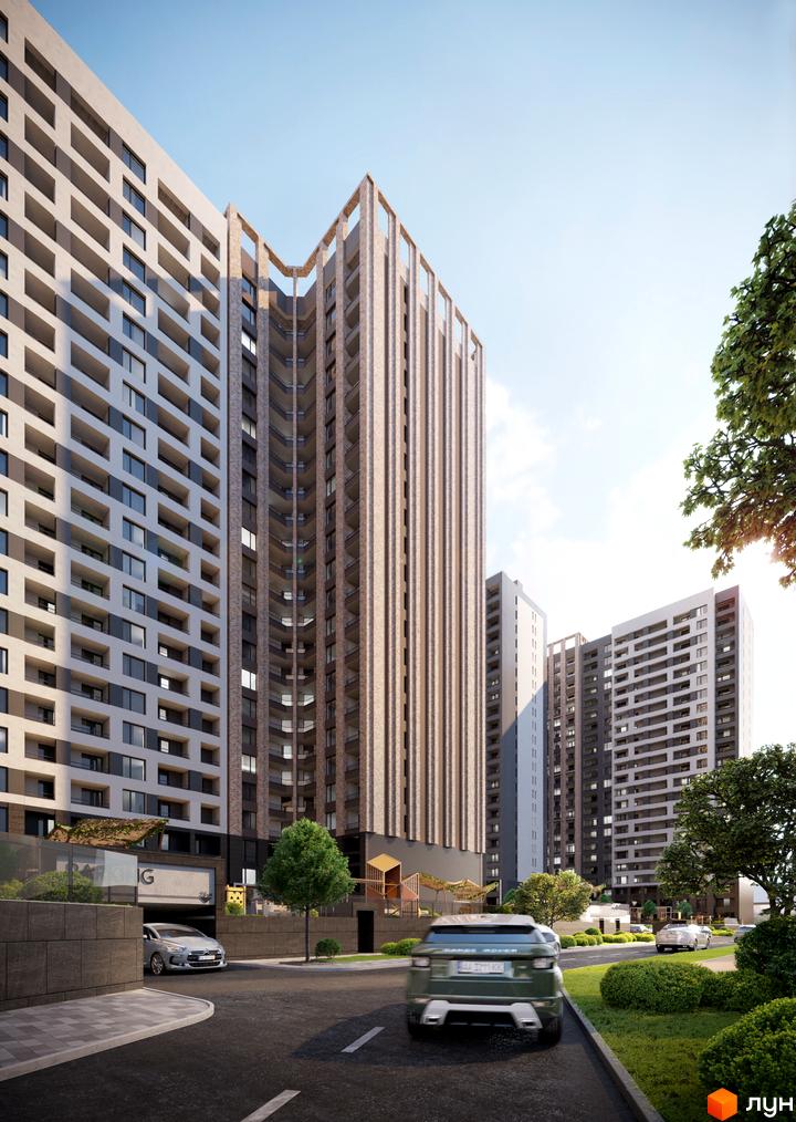 Новобудова ЖК Modern з фасадами з цегли та бетону, з балконами та панорамними вікнами. Прибудинкова територія з деревами та дорогою.