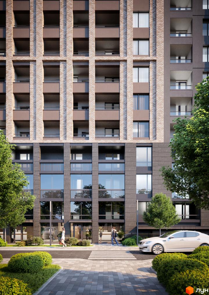 Фасад житлового комплексу Modern з цегляними та темними елементами, балконами та великими вікнами. Прибудинкова територія з деревами, кущами та дорогою.