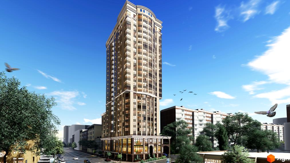 Висотна будівля ЖК Володимирський з панорамними вікнами. Навколо будівлі зелені насадження та блакитне небо з птахами.