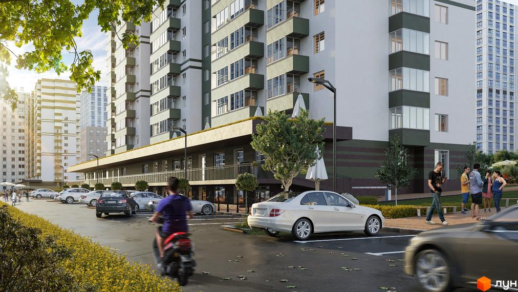 Зображення фасаду Житлового комплексу Набережний та прибудинкової території з парковкою. Вигляд багатоповерхового будинку з вулиці.