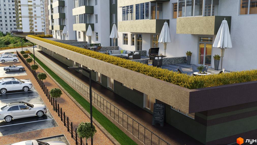 Фасад Житлового комплексу Набережний з білими стінами та балконами. Прибудинкова територія має паркінг, пішохідну доріжку та зелені насадження.