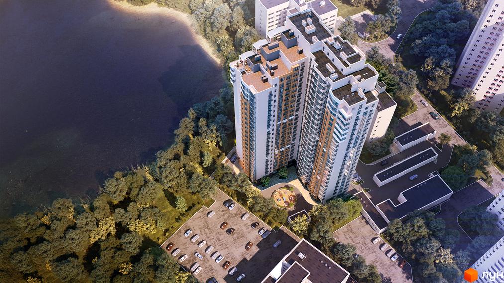 Високі будинки ЖК LAKE HOUSE біля озера. На території комплексу є парковка та дитячий майданчик.