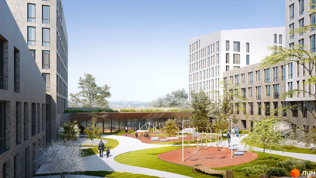 Житловий комплекс Містечко Підзамче з цегляними та білими фасадами, дитячим майданчиком та зеленим подвір'ям.