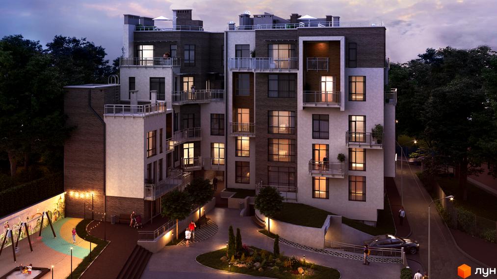 Клубний будинок „Мій на Карманського“ з цегляними та білими фасадами, балконами та великими вікнами. На прибудинковій території дитячий майданчик, зелені насадження та освітлення.