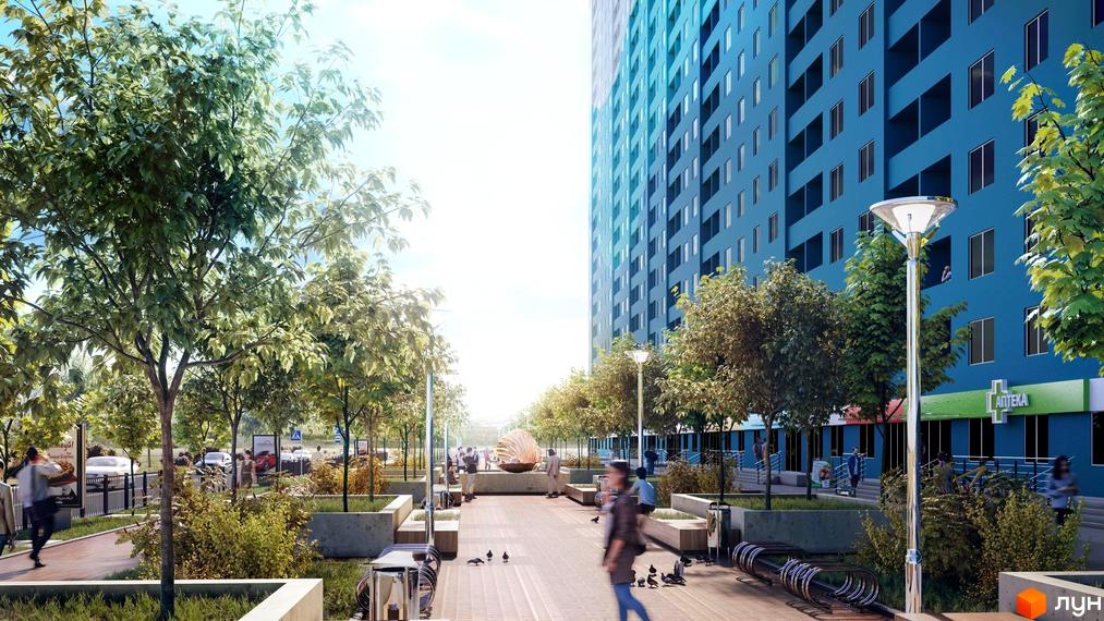Висотна будівля ЖК Одеський бульвар з блакитним фасадом. На передньому плані алея з деревами, лавками та ліхтарями.