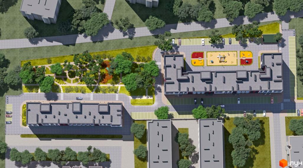 Вид зверху на житловий комплекс Нові Метри Park з сучасними будинками та доглянутою прибудинковою територією з дитячим майданчиком та парковкою.