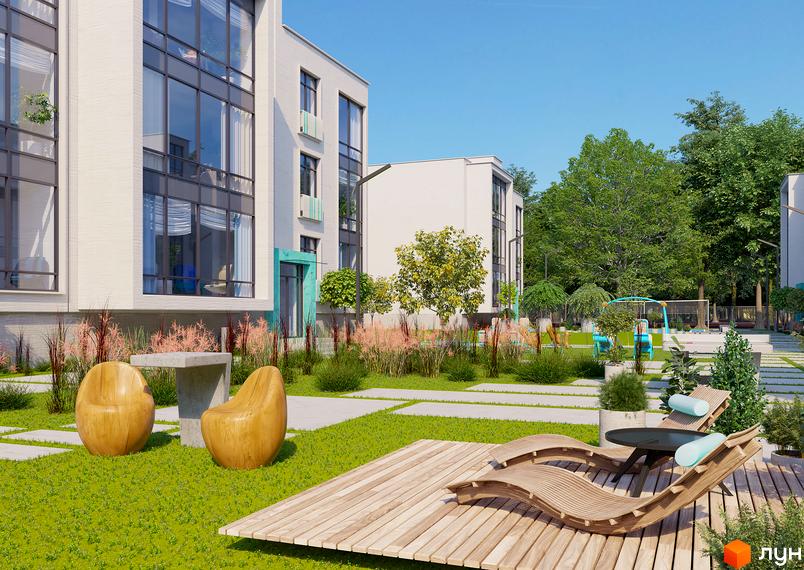 Зовнішній вигляд будинку ЖК Ібіс з великими вікнами та зеленою прибудинковою територією з зонами відпочинку та дитячим майданчиком.