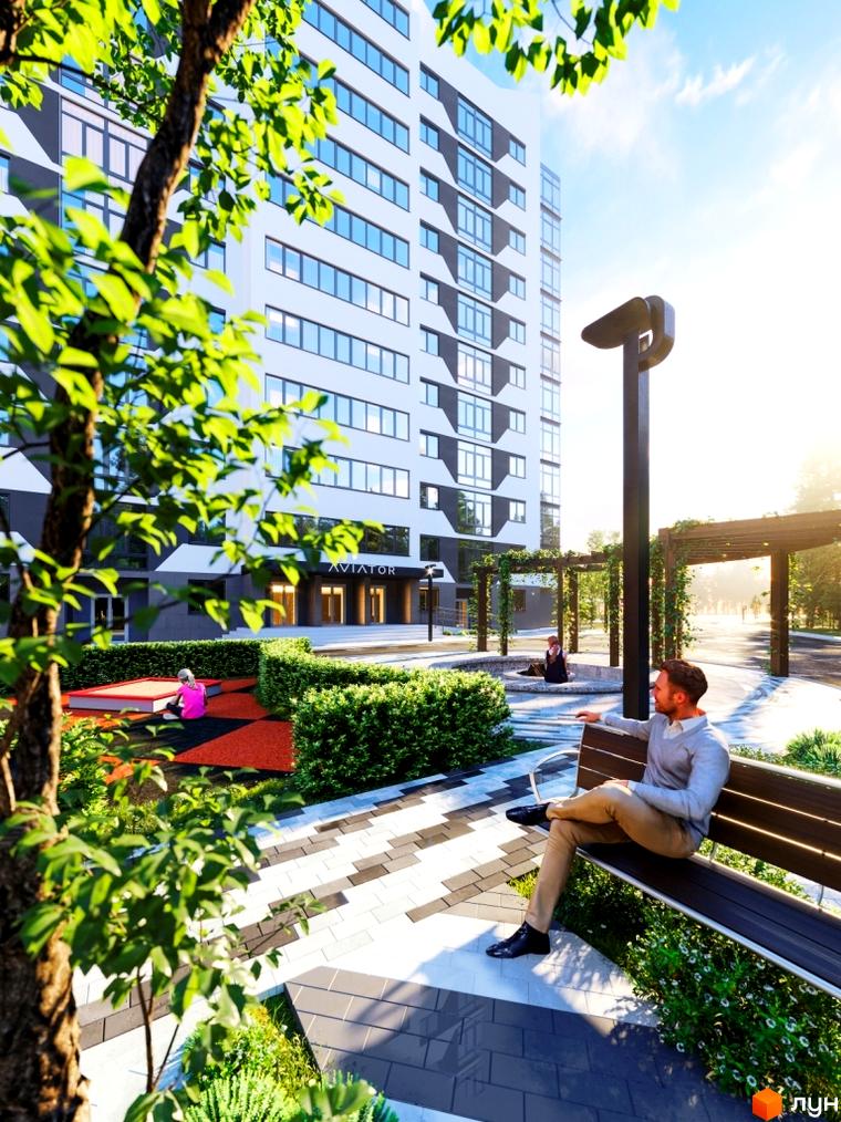 Житловий комплекс Авіатор: біла багатоповерхівка з вікнами та темними декоративними елементами. Доглянутий двір з зеленню та зонами відпочинку.