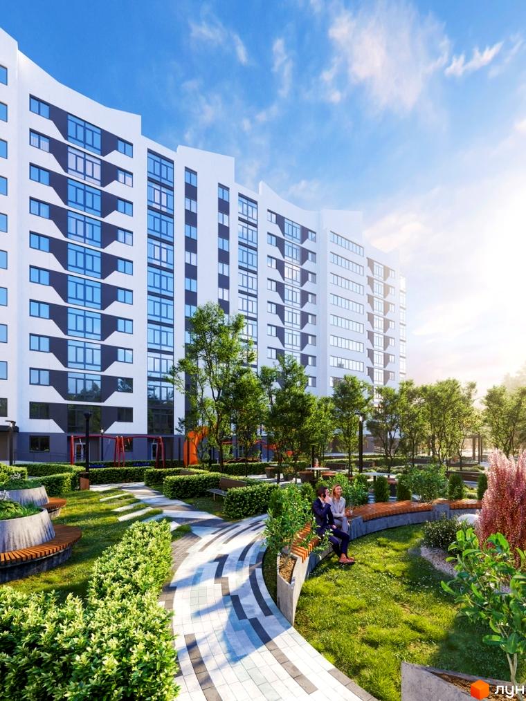 Житловий комплекс Авіатор: білий вигнутий фасад з сірими акцентами та синіми вікнами. Зелена прибудинкова територія з ландшафтним дизайном.
