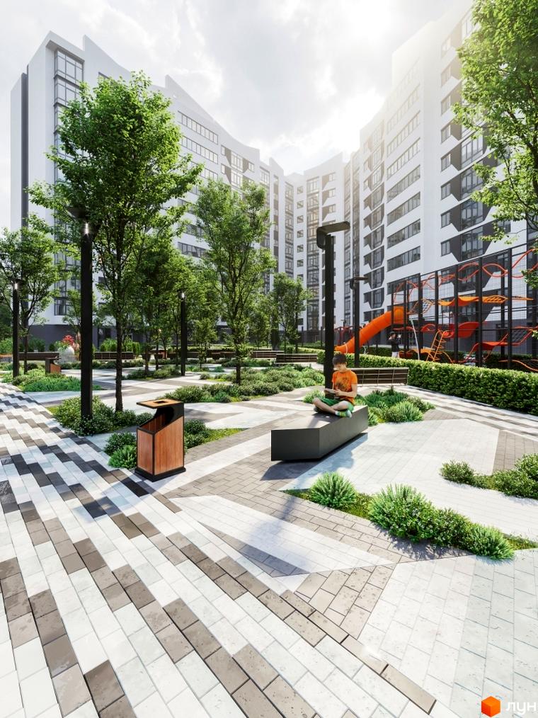 Житловий комплекс Авіатор з білими фасадами та великими вікнами. На прибудинковій території дитячий майданчик, зелені насадження та місця для відпочинку.