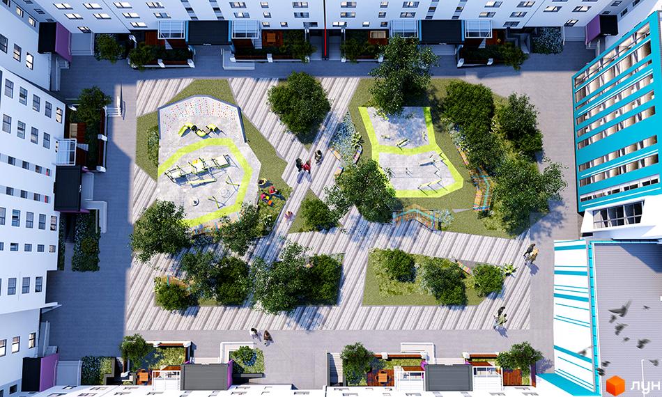 Вид на територію Житловий комплекс Синергія Glass з висоти пташиного польоту. На території є дитячий майданчик та зелені насадження.