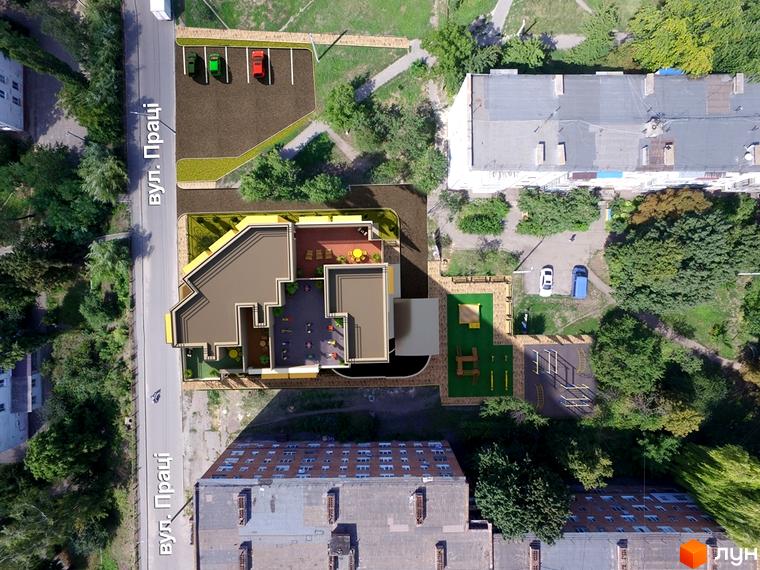 Клубний будинок „Сонячний“ з терасами та дитячим майданчиком. Зверху видно паркінг та зелену зону.