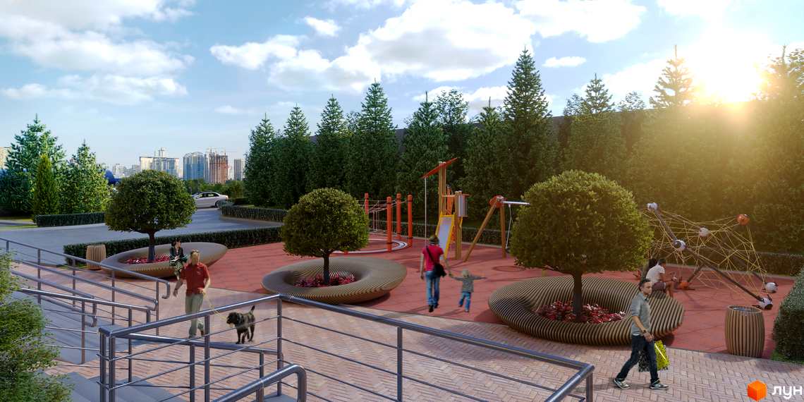 Вигляд прибудинкової території Житлового комплексу Берег Дніпра з дитячим майданчиком та місцями для відпочинку.