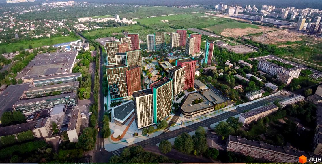 Вид зверху на Житловий комплекс Dibrova Park: багатоповерхові будинки з кольоровими фасадами та велика зелена територія з дитячими майданчиками.