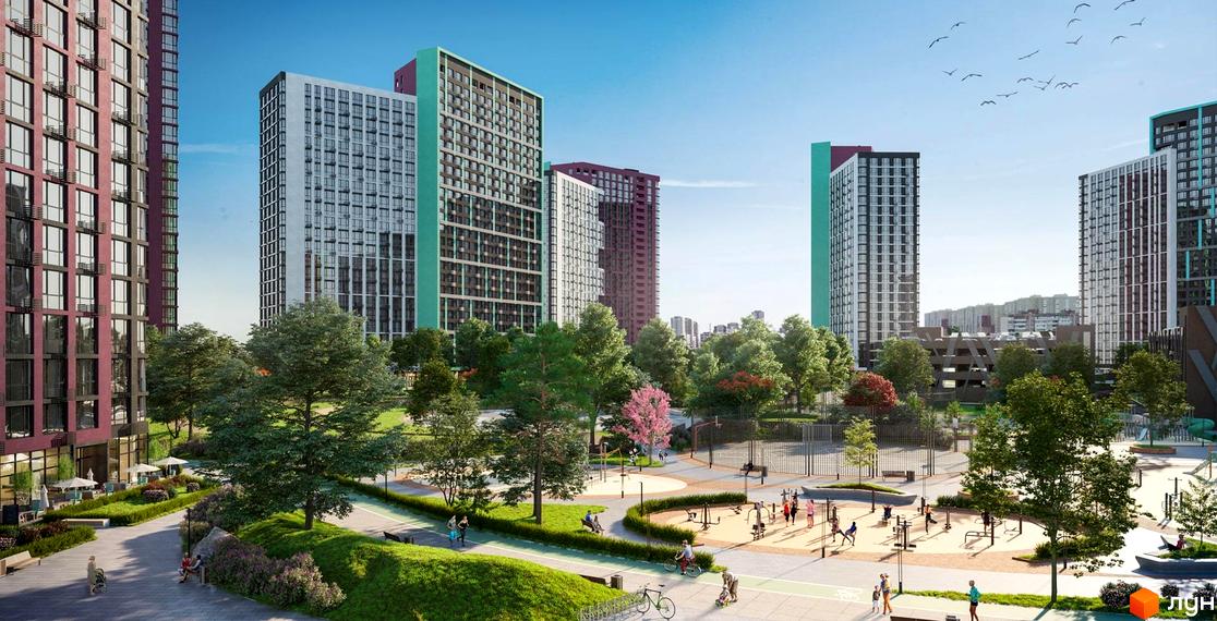 Багатоповерхові будинки ЖК Dibrova Park з різнокольоровими фасадами. Прибудинкова територія має зелені зони, доріжки та спортивні майданчики.