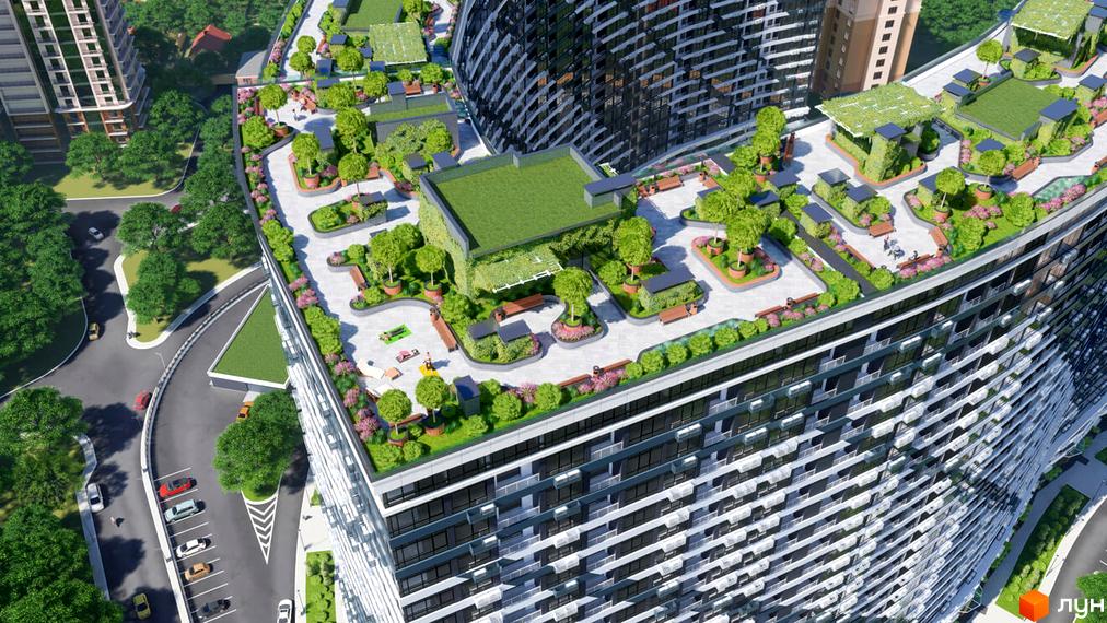 Житловий комплекс Атмосфера з зеленими дахами та доглянутою прибудинковою територією з деревами, газонами та місцями для відпочинку.