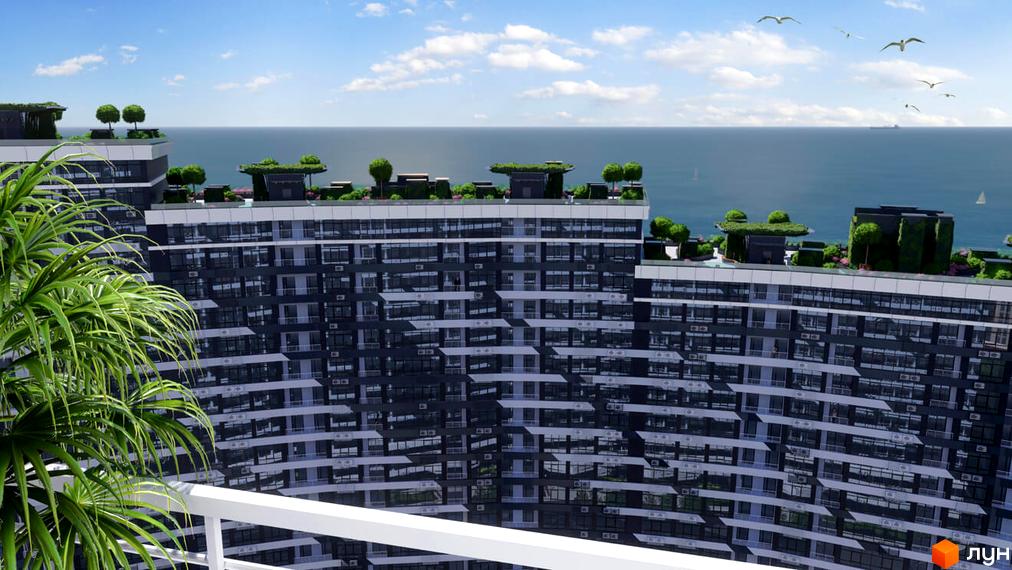 Вид на багатоповерховий будинок ЖК Атмосфера з терасами та озелененням на даху, на фоні моря та неба з птахами.
