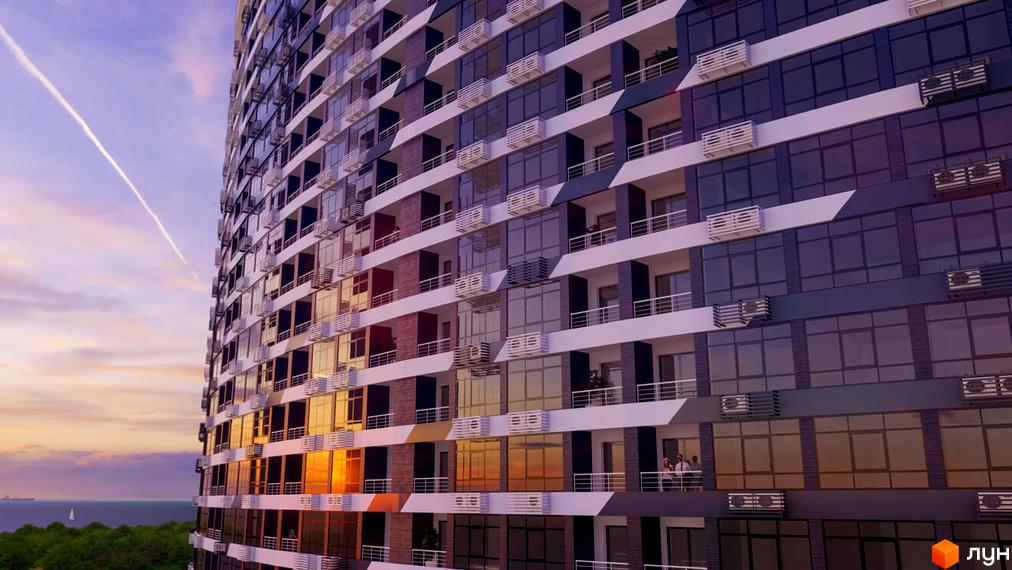 Висотна будівля ЖК Атмосфера з панорамними вікнами та балконами. Навколо видно море та зелень, що створює відчуття комфорту та спокою.