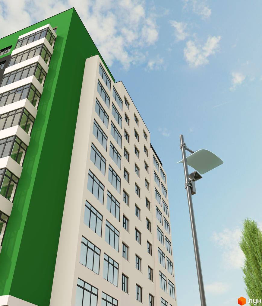 Зовнішній вигляд житлового комплексу Київський з фасадом білого та зеленого кольорів, великими вікнами та балконами. Поруч видно ліхтар та зелене дерево на фоні блакитного неба з хмарами.