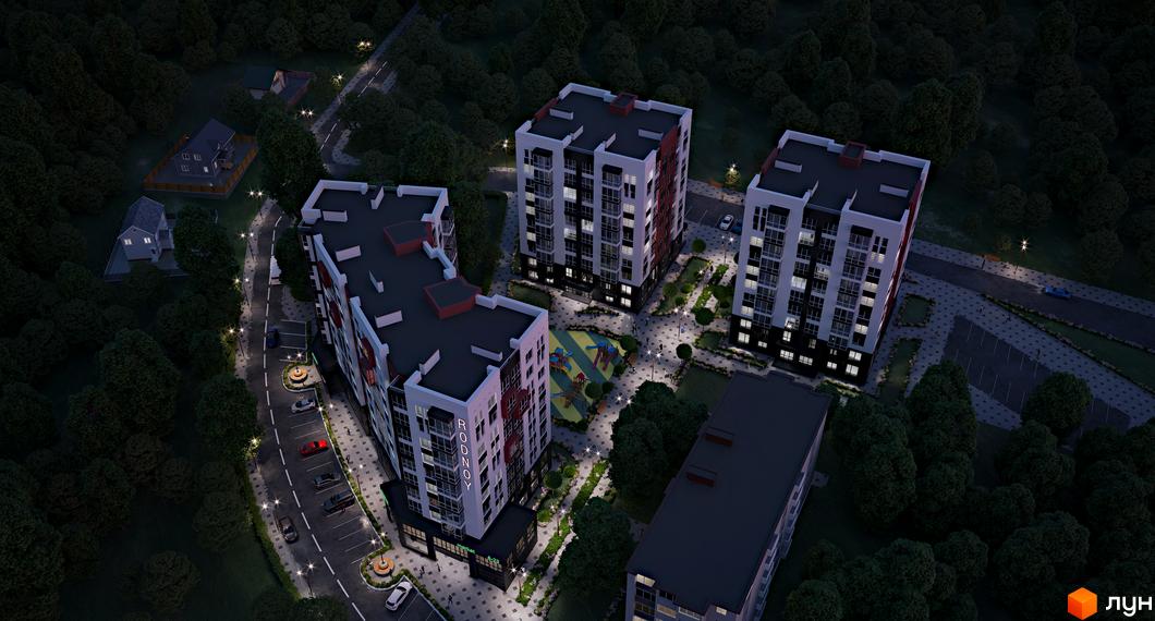 Житловий комплекс Рідний з фасадами білого та червоного кольорів, з великою кількістю вікон, на тлі темного нічного неба та зелених дерев. Територія освітлена ліхтарями, є дитячий майданчик та парковка.