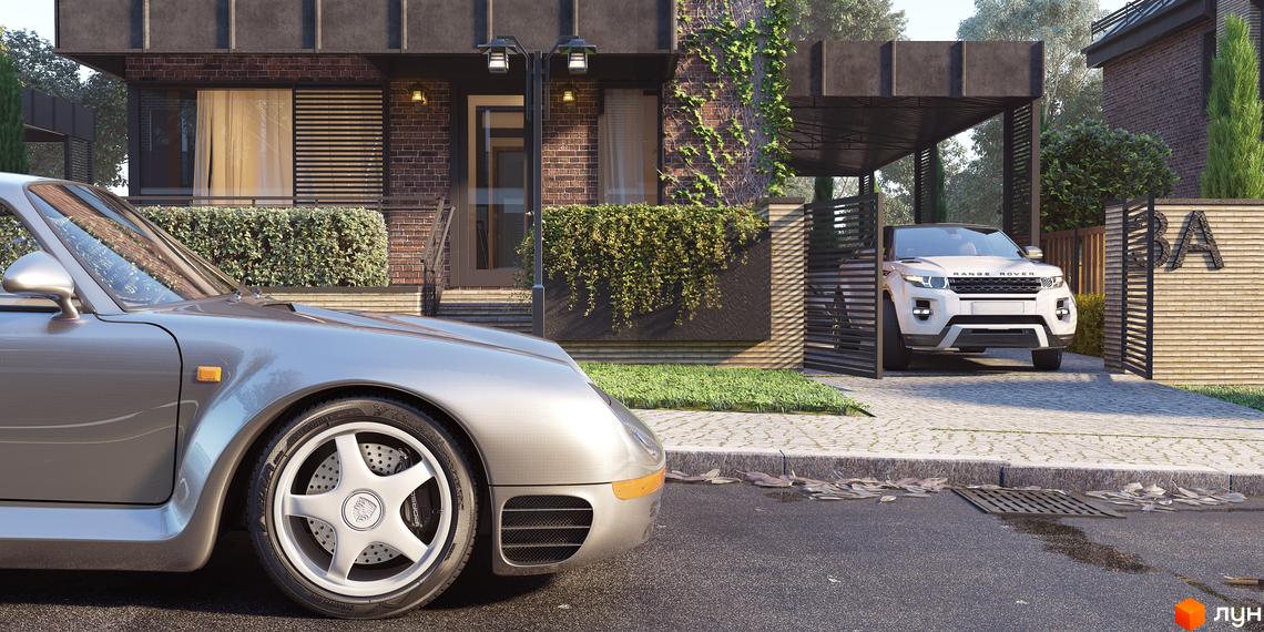 Будинок Котеджного містечка Oak Grove Town з темної цегли та великими вікнами, оточений зеленими насадженнями та автомобілями.