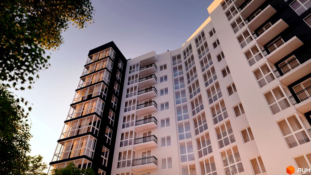 Новобудова ЖК Kaiser Park з білою та чорною фасадною частиною та численними балконами. Зовнішній вигляд комплексу з низького ракурсу на фоні ясного неба.