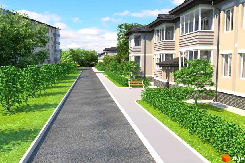 Зовнішній вигляд будинків житлового комплексу Городок з заскленими балконами та доглянутою прибудинковою територією з зеленими насадженнями та доріжками.